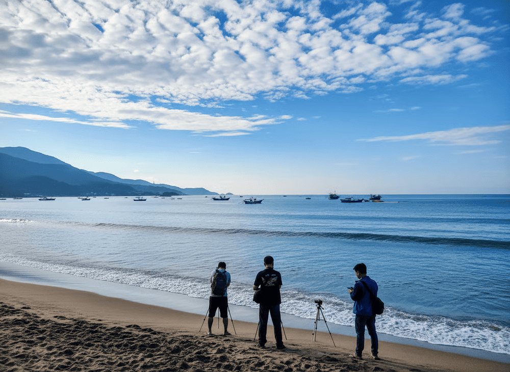 My Khe Beach glows in golden light as the sky fades into pink, and purple at sunset